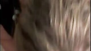 wife in car seat while husband films