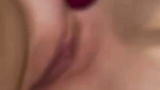 Lindsay Mackenzie masturbating with purple vibrator.