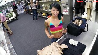 Asian pawnshop guest buffing the knob