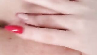 Naked beauty with perfect breasts masturbates. Close-up.