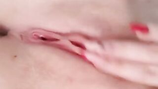 Naked beauty with perfect breasts masturbates. Close-up.