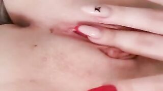 Naked beauty with perfect breasts masturbates. Close-up.