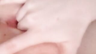 Naked beauty with perfect breasts masturbates. Close-up.