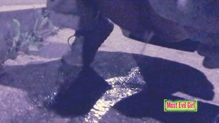 Girl alone at night in a parking lot lowers her pants in public to piss