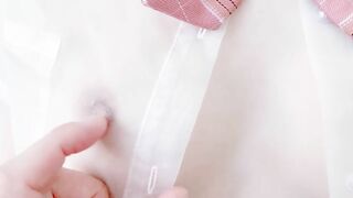 A fashion model wearing a see-through sailor suit gets excited when a masseuse touches her nipples