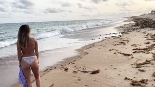 On the beach topless in panties flashing pussy