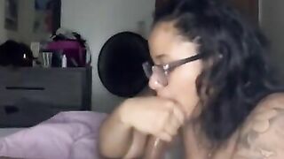 Freaky bitch in glasses sucking dick