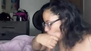 Freaky bitch in glasses sucking dick