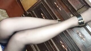 I stroke my legs in black stockings