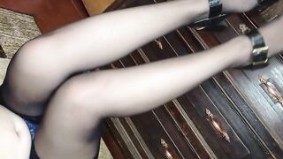 I stroke my legs in black stockings