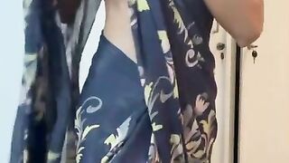 Amateur Indian Desi girl does saree strip tease for her boyfriend during a wedding