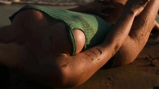 Girl with big boobs masturbates on the beach.