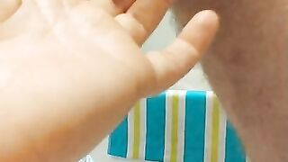 Red head puts tiny cage on cock