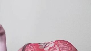 Susi on the bed. She has a sexy fishnet dress on fucking with toy