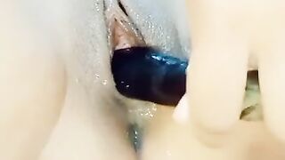 Asian hottie fucks eggplant and squirts
