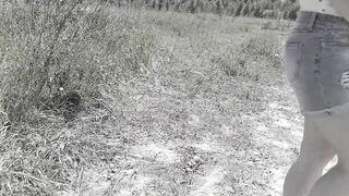 Slim MILF pissing on the side of the road