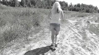 Slim MILF pissing on the side of the road