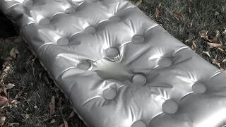 Pissing on an air mattress by a milf with a hairy pussy and big natural tits.