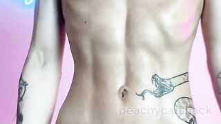 Petite and cute Asian muscle girl oils her six-pack abs and flexes