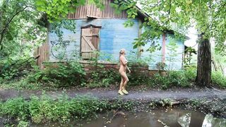 Nude girl and old house and dirty road