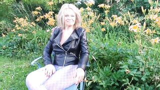 Martina West in her garden showing her sexy legs