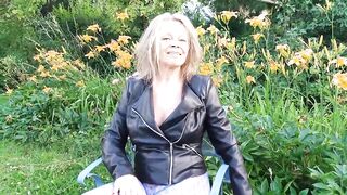 Martina West in her garden showing her sexy legs