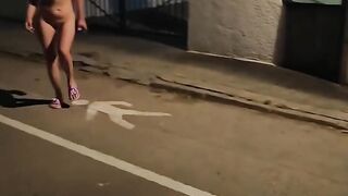 Naked blonde walks on a public street