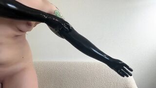 Hot Domme Redhead Teases in Latex Opera Gloves and Thigh High Boots